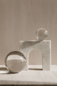 Kaboompics - Clear Glass Sphere on Marble Pedestal