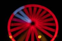 Kaboompics - Red Ferris Wheel with Blue-White Spokes Across the Upper Left