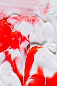 Kaboompics - Red Paint Swipe across Pale Pink and White for Social Media and Story Backgrounds