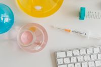 Kaboompics - Colorful Chemistry Workspace With Syringe and Keyboard