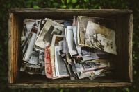 Kaboompics - Vintage Snapshots Arranged Inside a Weathered Wooden Box
