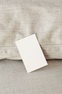 Kaboompics - Tall Portrait Business Card Mockup on Beige Linen
