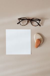 Kaboompics - Blank Stationery Card with Glasses and Neutral Stone Props