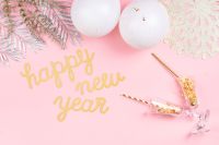Kaboompics - Happy New Year Pink Background with Tinsel and Balloons