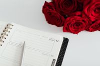 Kaboompics - February 14 Planner Page with Pen and Red Roses, Calendar Close-Up