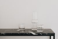 Kaboompics - Glass Carafe and Two Water Glasses on a Black Marble Console
