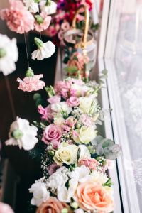 Colorful Flower Bouquets and Hanging Carnation Decor by a Bright Window: Floral Backgrounds