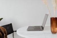 Kaboompics - MacBook Pro 15 laptop and iPhone 11 Pro on a marble table