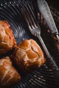 Kaboompics - Close-Up of Sweet Buns with an Ornate Fork and Knife