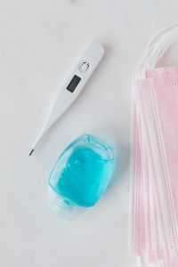 Kaboompics - Digital Thermometer, Blue Sanitizer and Pink Face Masks