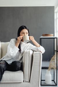 Kaboompics - Woman Taking a Quiet Coffee Break on the Couch