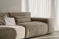 Kaboompics - White Laptop on a Neutral Sofa in a Bright Minimal Home Office