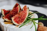 Kaboompics - Close-Up of Fresh Fig Slices and Rosemary on Camembert