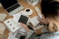 Kaboompics - Laptop, Coffee and Architectural Sketches in a Material Selection Workspace