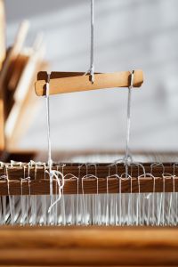 Kaboompics - Loom Detail with Tensioned White Yarn