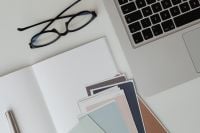 Kaboompics - Paint Color Swatches and Eyeglasses Beside Laptop