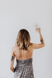 Kaboompics - Woman Celebrating with a Drink on New Year's Eve