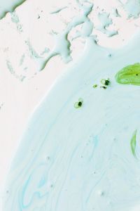 Kaboompics - Soft Aqua and Mint Green Liquid Paint Texture with Subtle Bubbles for Design Backgrounds