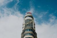 Kaboompics - Capitol Building and Schweppes Sign Rising Above Gran Vía in Madrid