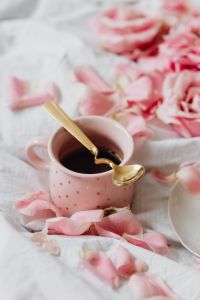 Kaboompics - Pink Coffee Cup with Gold Spoon and Rose Petals