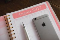 Kaboompics - August 2017 Pink Monthly Calendar with Smartphone and Silver Pen, Planner Flat Lay