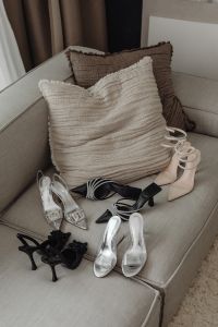 Kaboompics - Silver Crystal-Buckle Heels Styled with Neutral Sofa Cushions