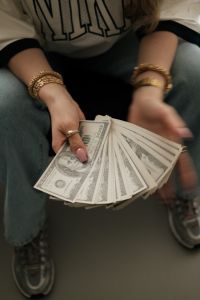 Kaboompics - Woman Holding Dollar Bills Rich Lifestyle Aesthetic