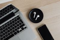 Kaboompics - Laptop, AirPods and Smartphone on Wooden Desk