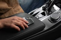 Kaboompics - Hand on a Black Leather Car Armrest Close Up