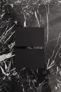 Kaboompics - Black Business Card Mockup on Veined Marble, Vertical Branding Layout