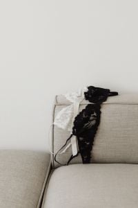 Kaboompics - Black and White Lace Bra Draped on Sofa