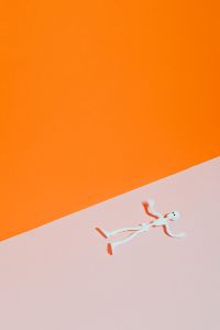Kaboompics - White Skeleton Halloween Figure Lying on Orange and Pink Background