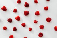 Kaboompics - Scattered Raspberries On White Marble