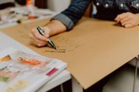 Kaboompics - Man hand holding a green marker pen
