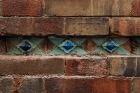 Kaboompics - Historic Brick Wall with Colorful Tile Detail