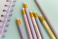 Kaboompics - Pastel Pencils Beside a Spiral Notebook