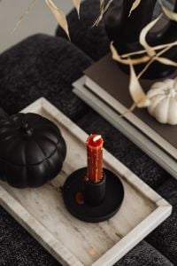 Kaboompics - Red Taper Candles With Black and White Pumpkins