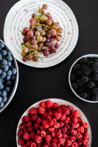 Kaboompics - Assorted Berries and Grapes on a Black Table