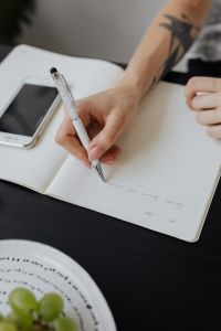 Kaboompics - Overhead View of Business Notes and Smartphone at Office Desk