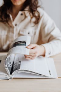 Kaboompics - Close-Up of Woman Holding Open Book