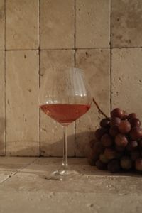 Kaboompics - Red Wine Glass beside Red Grapes