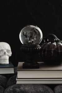 Kaboompics - Skull Crystal Ball and Black Pumpkin Arrangement