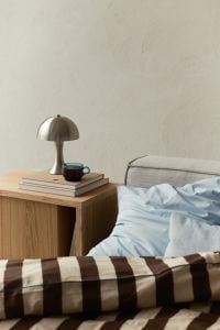 Kaboompics - Minimal Bedroom With Bedside Lamp and Striped Bedding