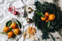 Kaboompics - Holiday Flat Lay of Mandarins, Ornaments and Evergreen
