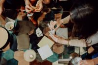 Kaboompics - Origami Workshop With Women Folding Paper at a Table