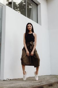 Kaboompics - Minimalist Full Body Portrait of Woman in Black Top and Brown Skirt