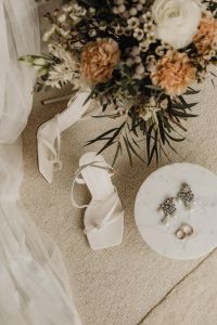 Kaboompics - Wedding Heels, Pearl Earrings and Gold Rings on Marble