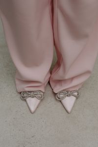 Kaboompics - Close-Up of Pink Trousers and Embellished Bow Heels