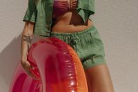 Kaboompics - Cropped Beach Fashion Portrait of Woman Holding a Pink Pool Float