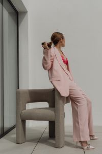 Kaboompics - Woman Sitting on a Chair in a Pale Pink Suit
